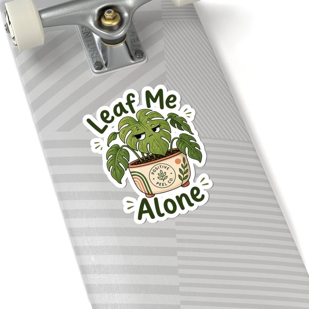 Funny plant sticker with grumpy monstera giving side eye saying leaf me alone — perfect gift for introverts and plant lovers