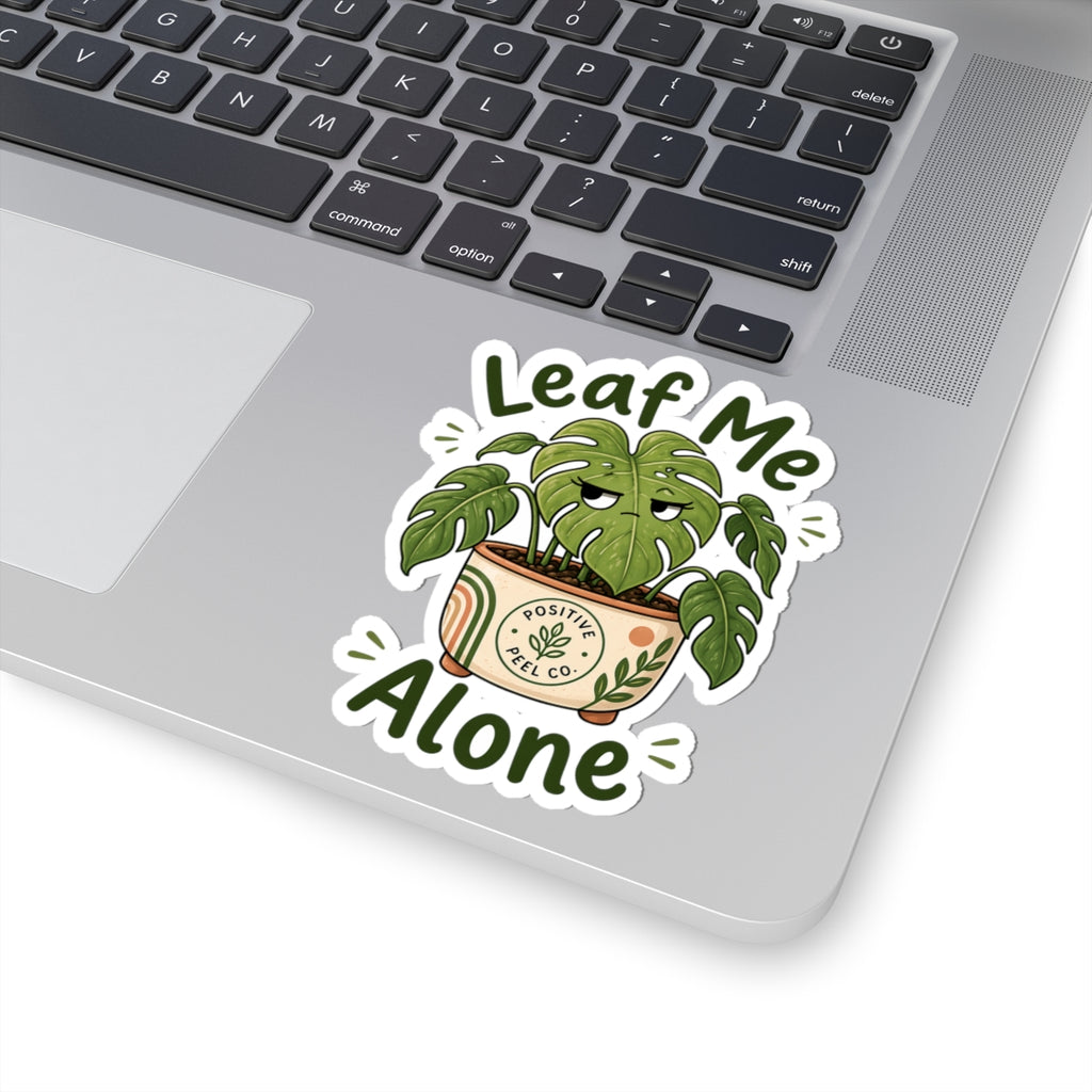 Funny plant sticker with grumpy monstera giving side eye saying leaf me alone — perfect gift for introverts and plant lovers