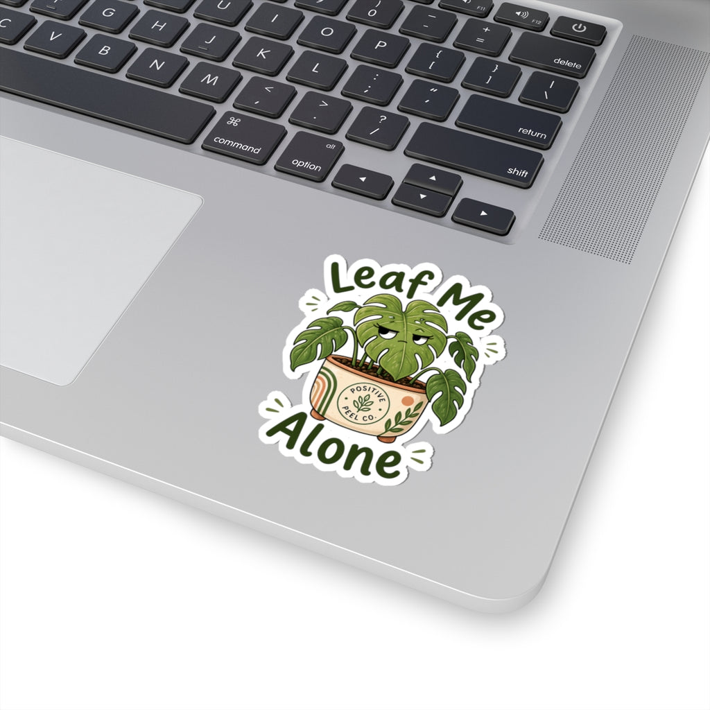 Funny plant sticker with grumpy monstera giving side eye saying leaf me alone — perfect gift for introverts and plant lovers